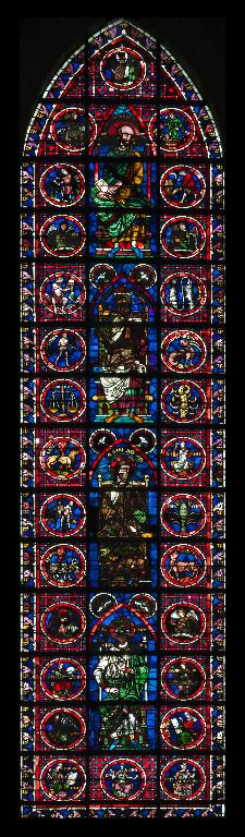 Verrière figurée (verrière à personnages) : Quatre ancêtres du Christ, le Zodiaque, les Saisons et les travaux des mois, les Arts libéraux (baie 103)
