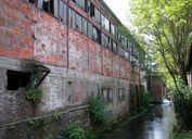 Ancien moulin à huile, puis moulin à farine Renet, devenu fromagerie industrielle Ancel, puis usine textile