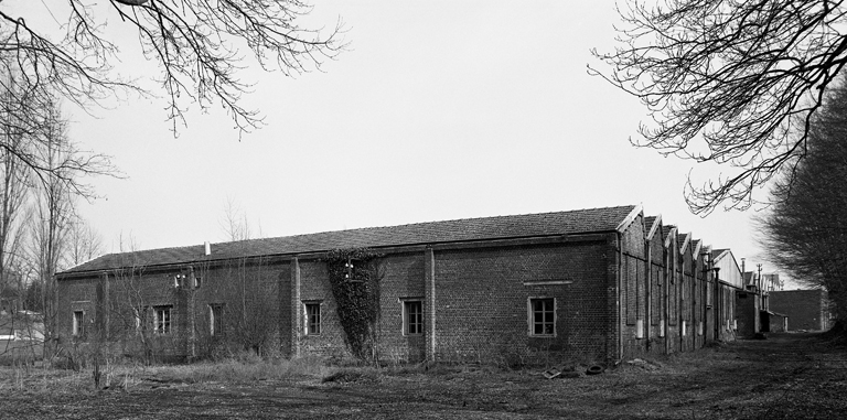 Ancienne filature de laine peignée Simon et Cie d'Esquéhéries, puis Carrissimo Fernand et Fils, puis Germ'Europe puis magasin industriel pour la confiturerie Materne de Boué