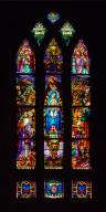 Ensemble des cinq verrières historiées du chœur de l'église Saint-Nicolas de Bapaume : la Trinité et scènes de la vie du Christ